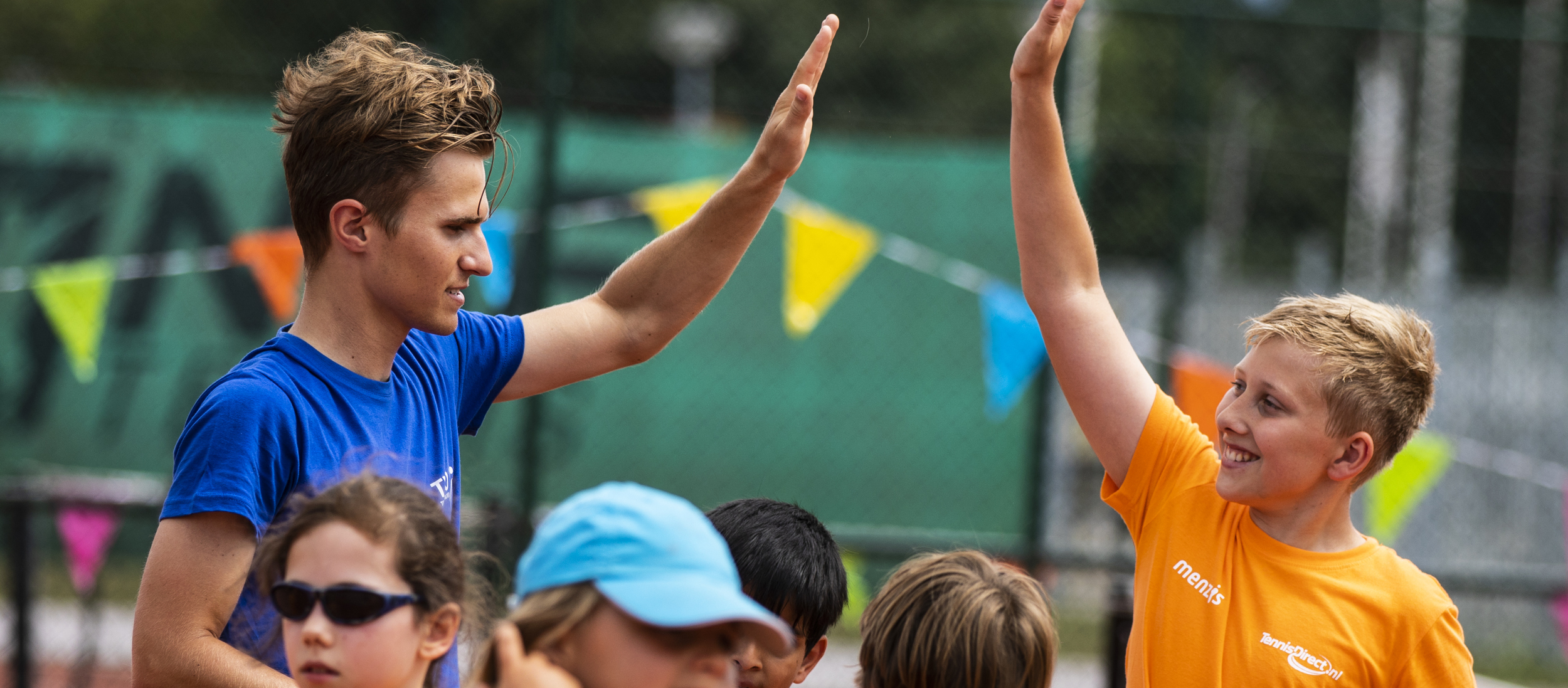 Tennis kids high five